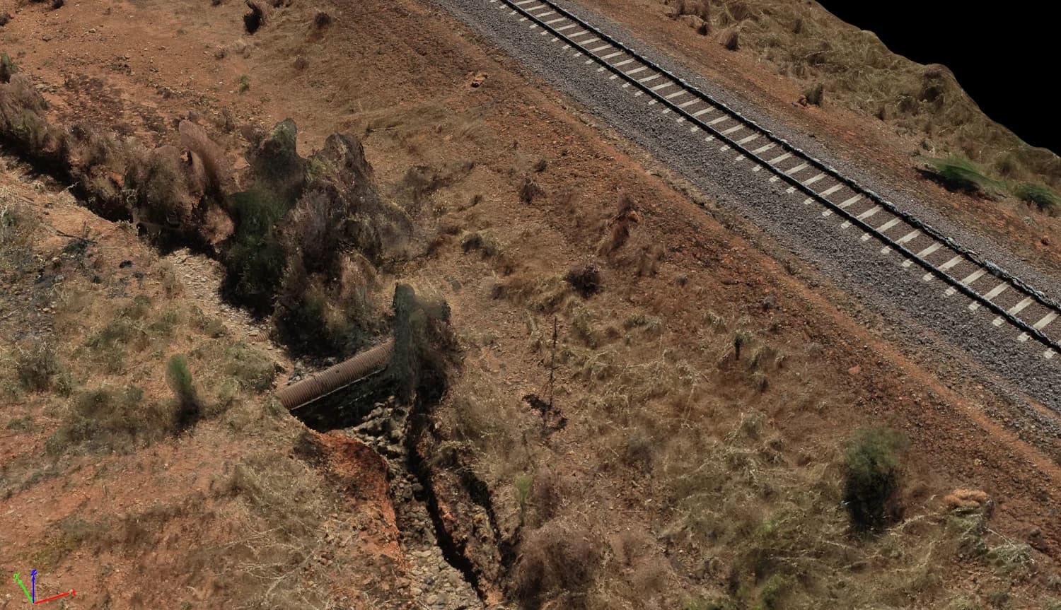 Textured 3D model showing railway tracks, a culvert and surrounding terrain
