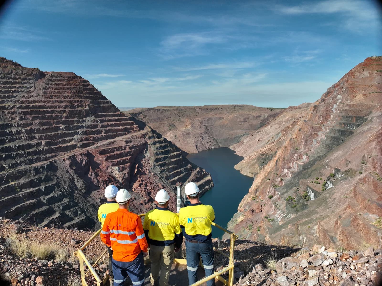 Site team in hard hats and high-visibility clothing at the Argyle pit lookout