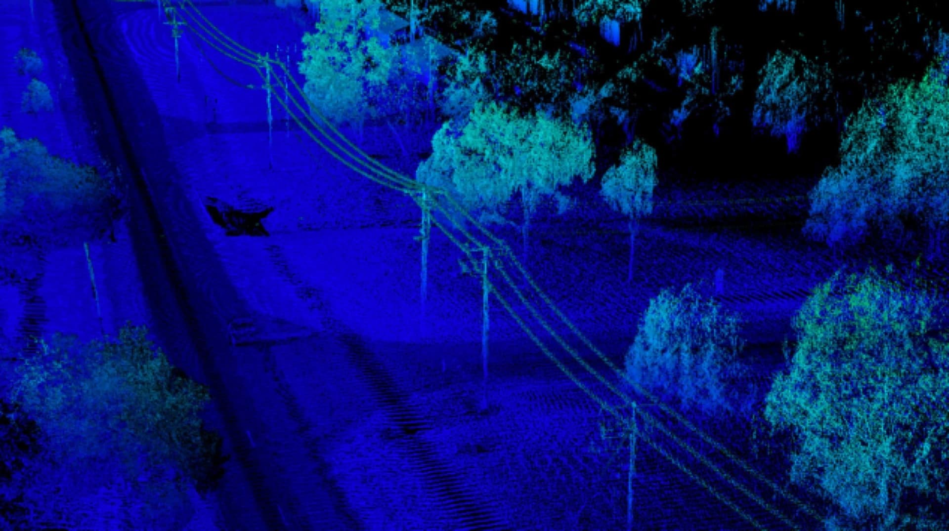 Blue LiDAR point cloud of a powerline corridor